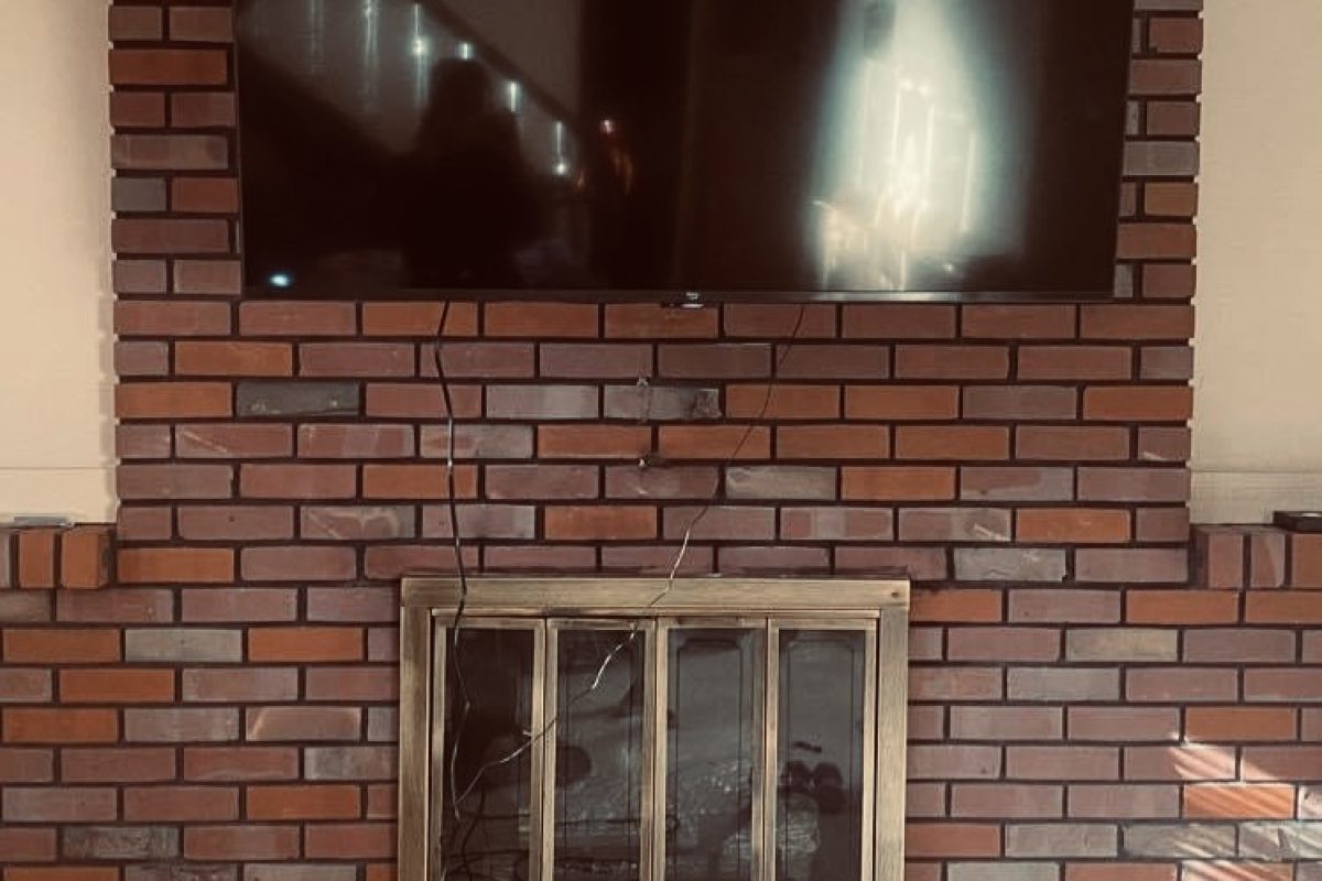 tv mounting on brick surface